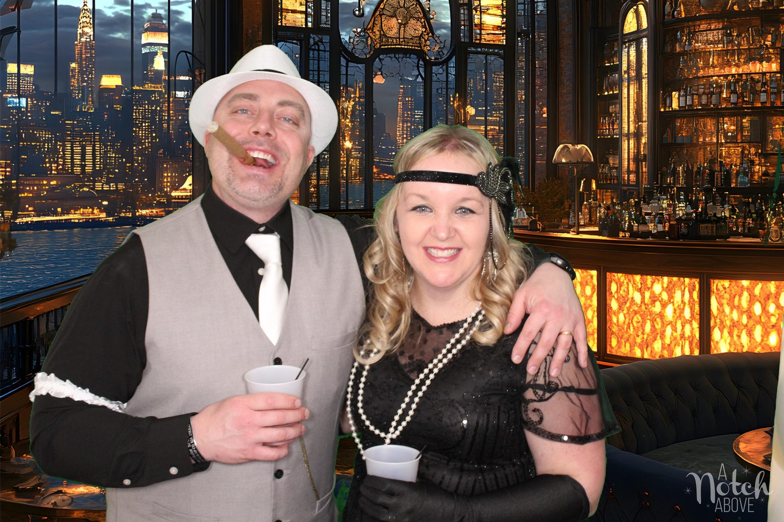 Guests in 1920s costumes at a corporate party photo booth