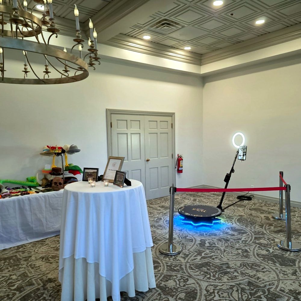360 video booth platform with stanchions at a party
