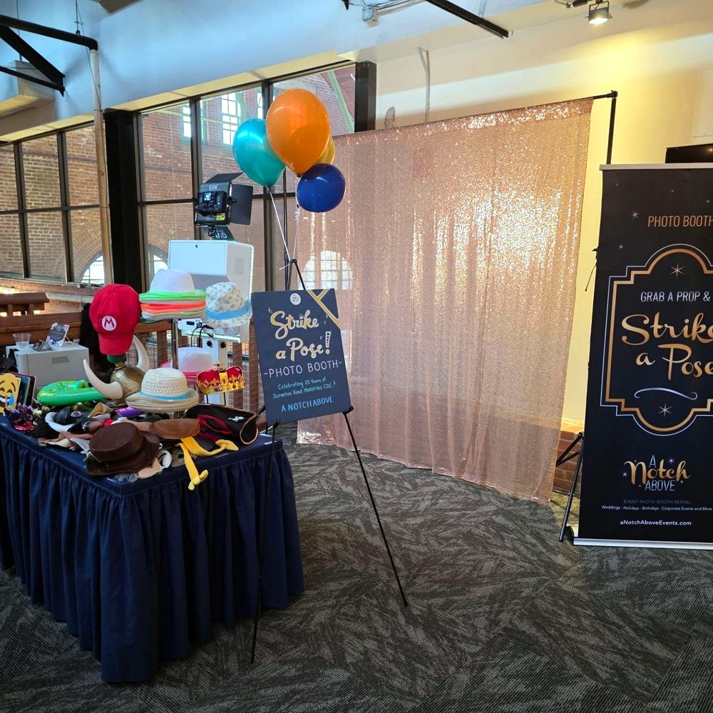 Sequin backdrop, props table, and Strike a Pose sign