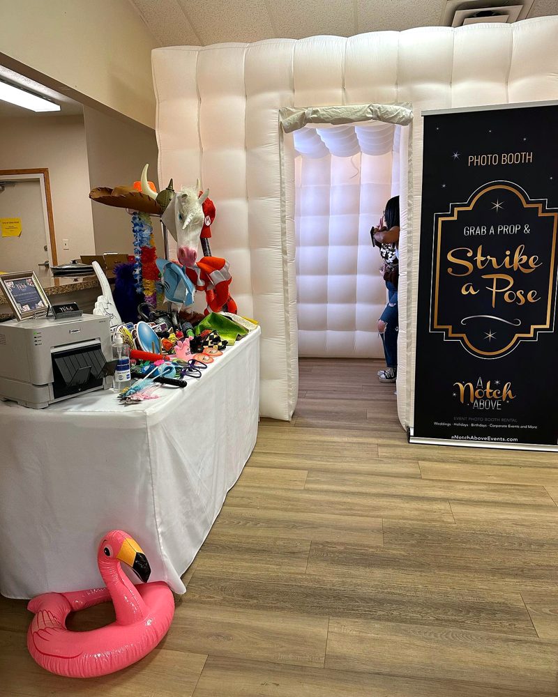 LED cube photo booth with props table and printer