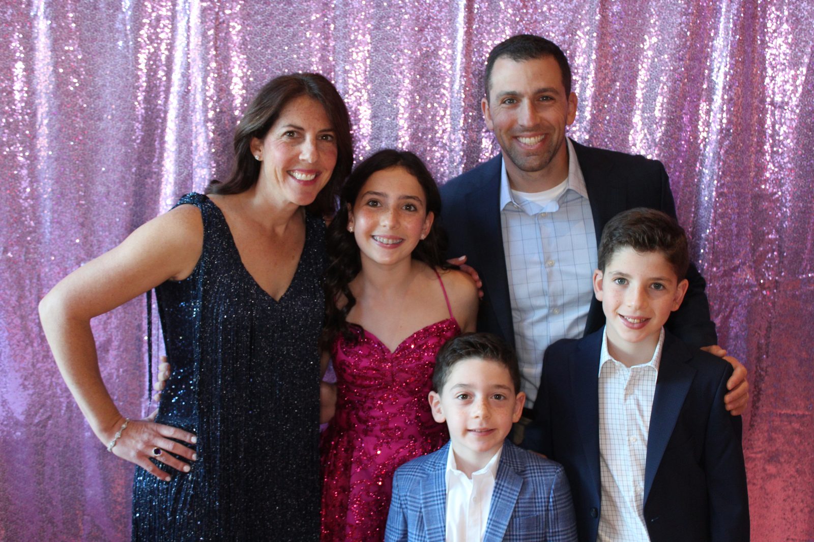 Family at a bat mitzvah photo booth