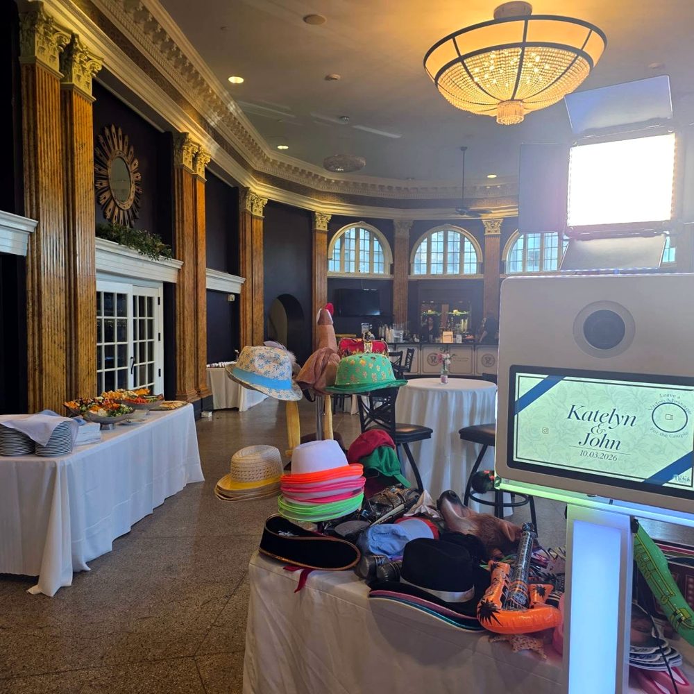 Selfie station set up with props at a wedding reception