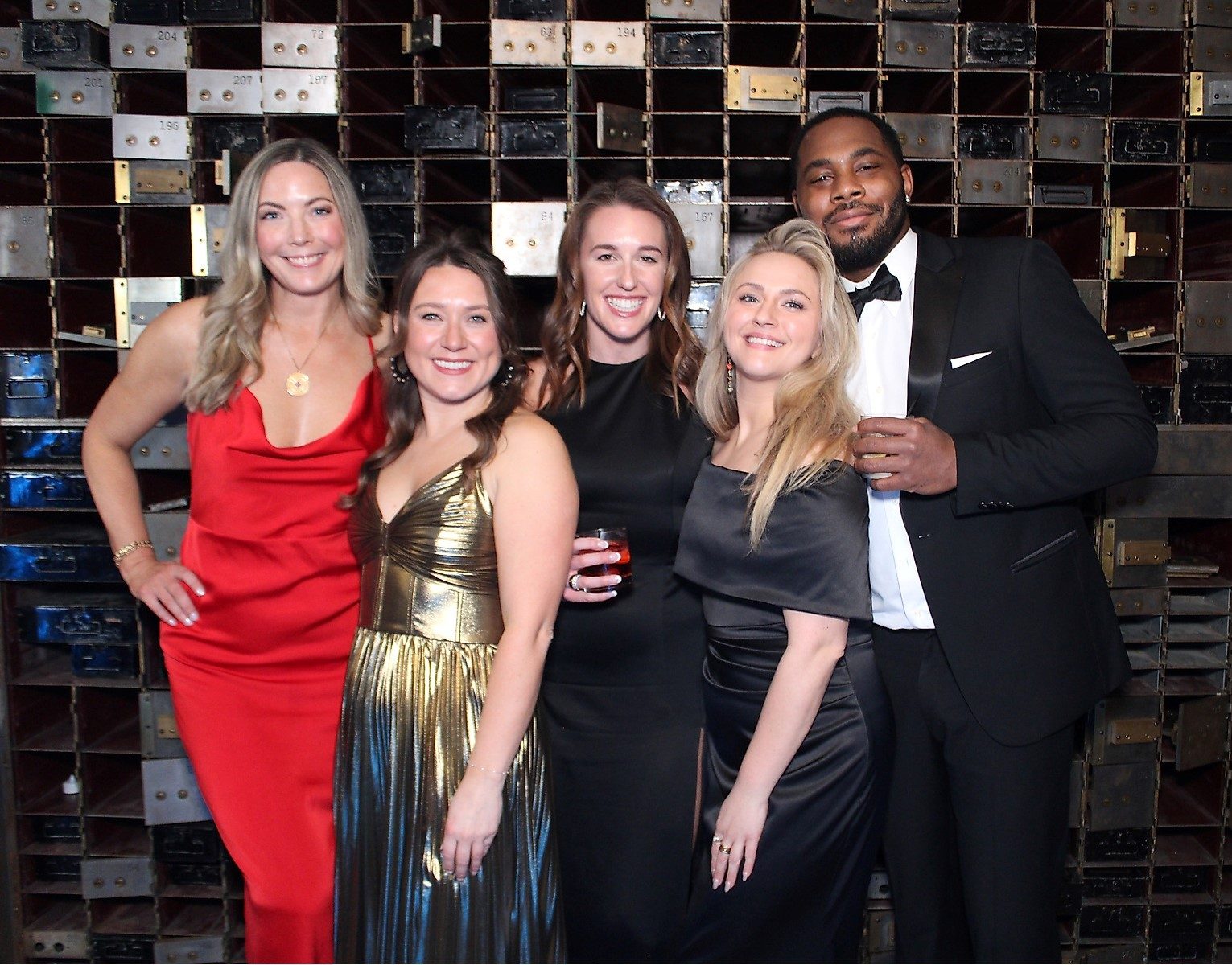Wedding guests in formal wear at the photo booth